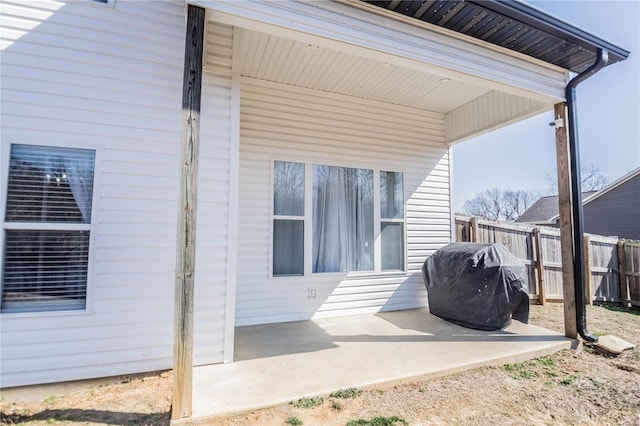 view of patio / terrace featuring fence