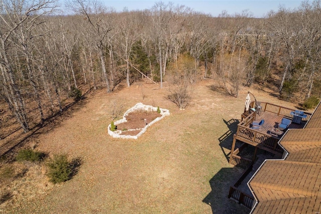 bird's eye view featuring a wooded view