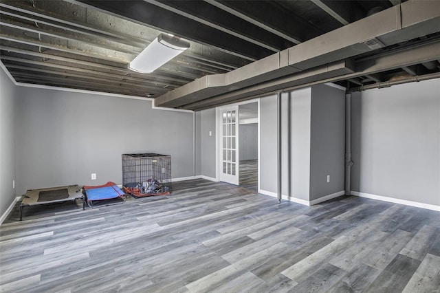 finished basement with baseboards and wood finished floors