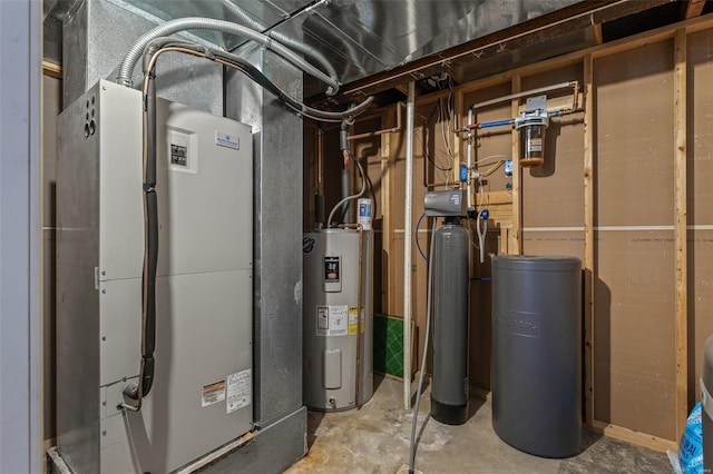 utility room with heating unit and electric water heater