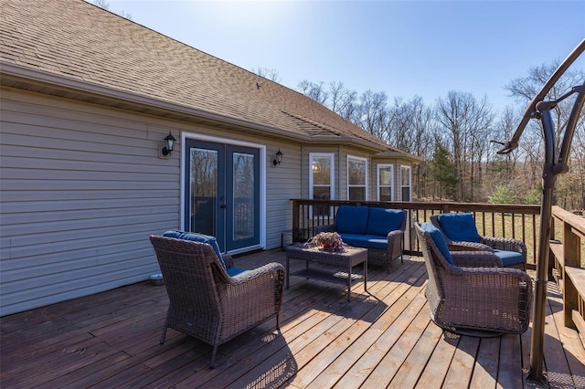 wooden terrace featuring an outdoor living space and french doors