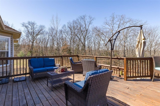 wooden terrace featuring an outdoor living space