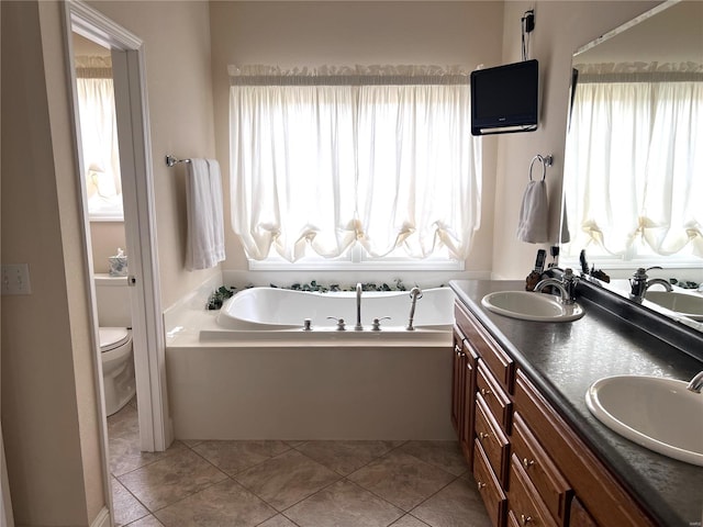 full bath with tile patterned floors, a sink, and a bath