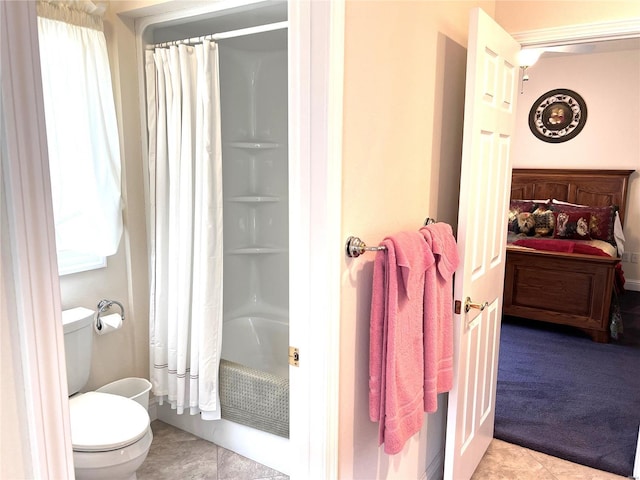 bathroom with toilet, tile patterned flooring, and shower / tub combo with curtain