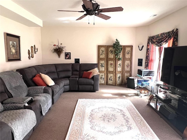 carpeted living area featuring ceiling fan and visible vents