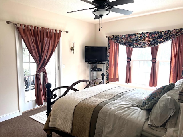 carpeted bedroom with baseboards and a ceiling fan