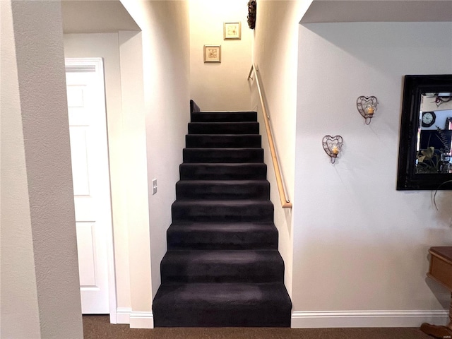 staircase with baseboards