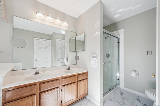 full bathroom with marble finish floor, a stall shower, toilet, and a sink