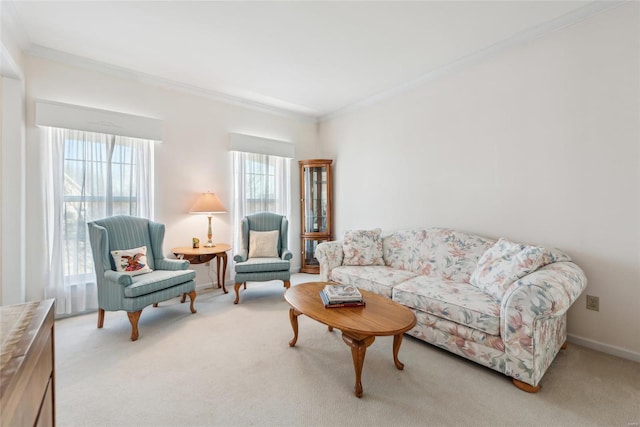 carpeted living room featuring baseboards and ornamental molding