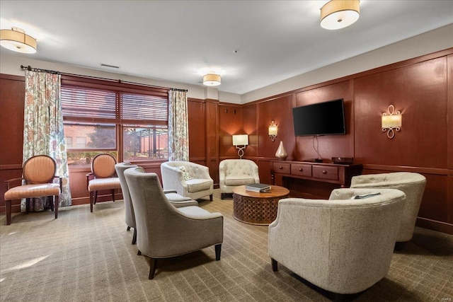 carpeted living area featuring visible vents