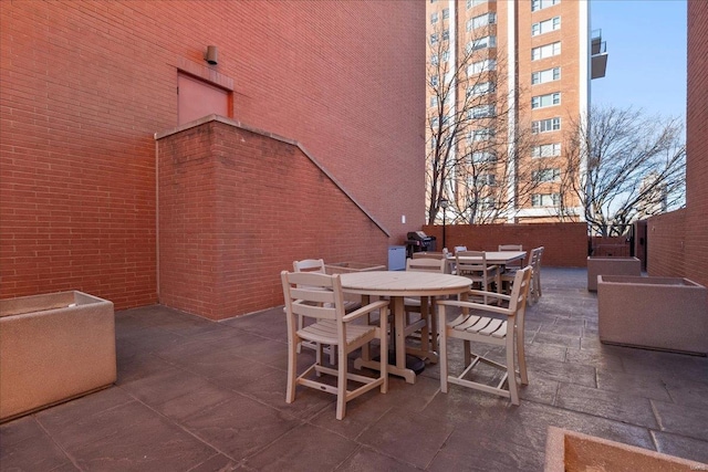 view of patio featuring outdoor dining area