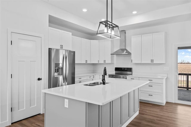 kitchen with electric range oven, dark wood-type flooring, wall chimney range hood, stainless steel refrigerator with ice dispenser, and a sink