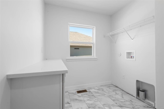 laundry area featuring marble finish floor, laundry area, washer hookup, and baseboards