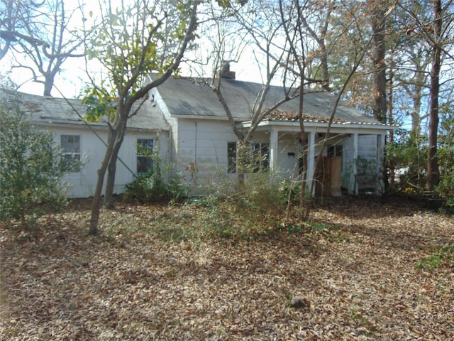 view of front of home featuring a chimney