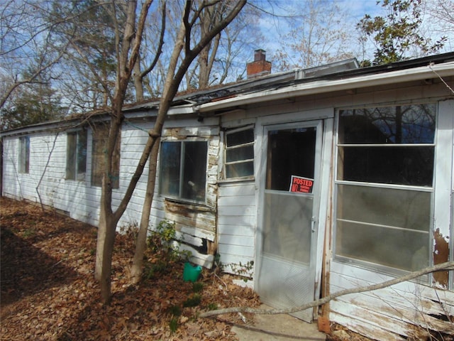 view of side of property with a chimney