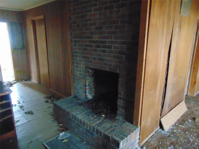 living area with a brick fireplace