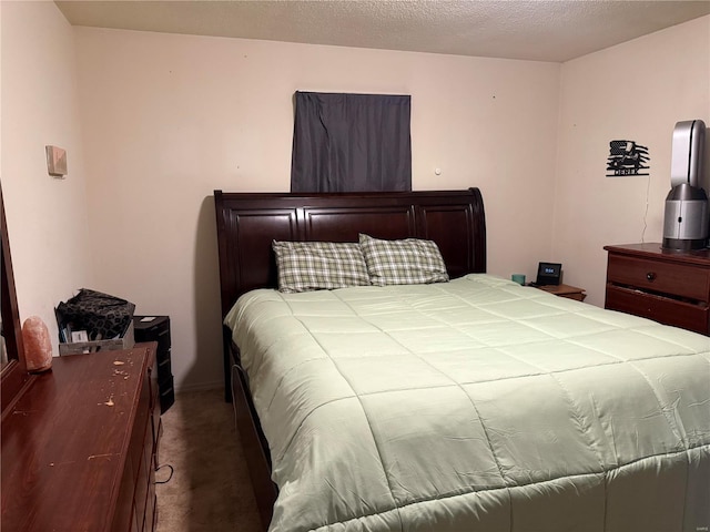 carpeted bedroom featuring a textured ceiling