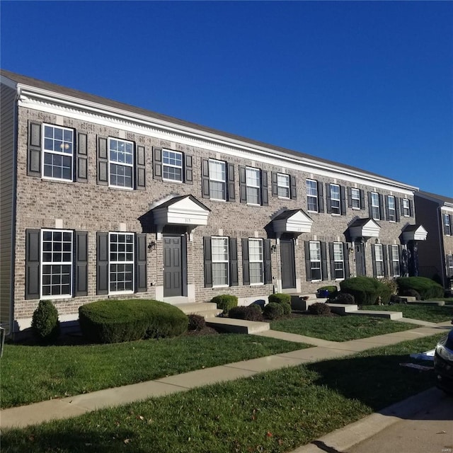 multi unit property featuring brick siding