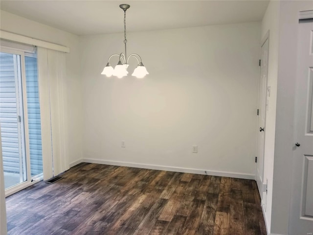 unfurnished dining area featuring a notable chandelier, dark wood finished floors, visible vents, and baseboards