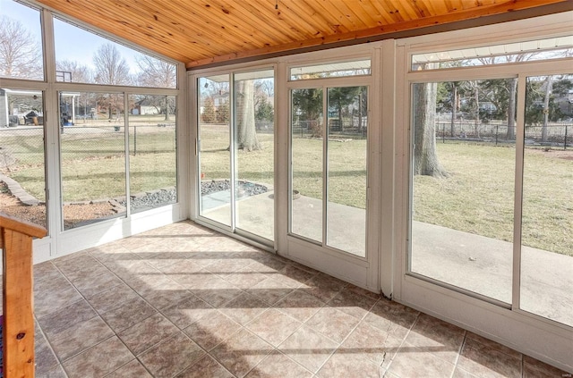 unfurnished sunroom featuring wood ceiling