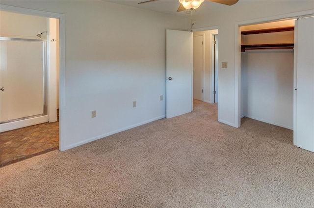 unfurnished bedroom featuring a ceiling fan, a closet, carpet flooring, and baseboards