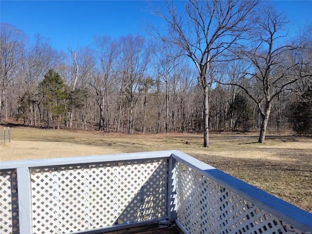 wooden deck featuring a view of trees