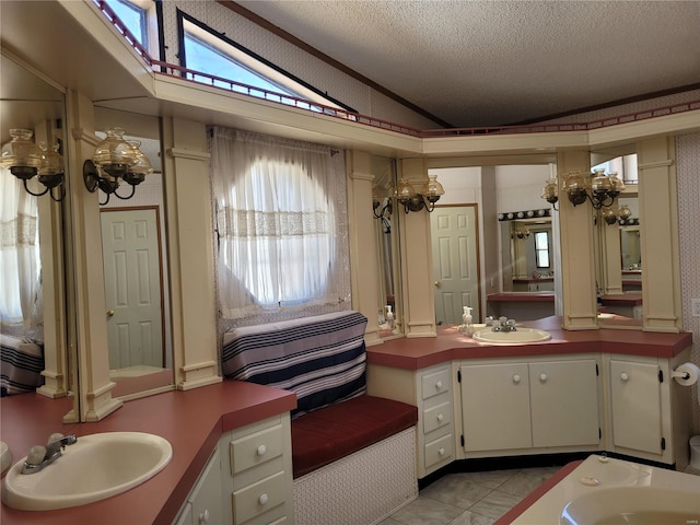 full bath with lofted ceiling, a textured ceiling, and vanity