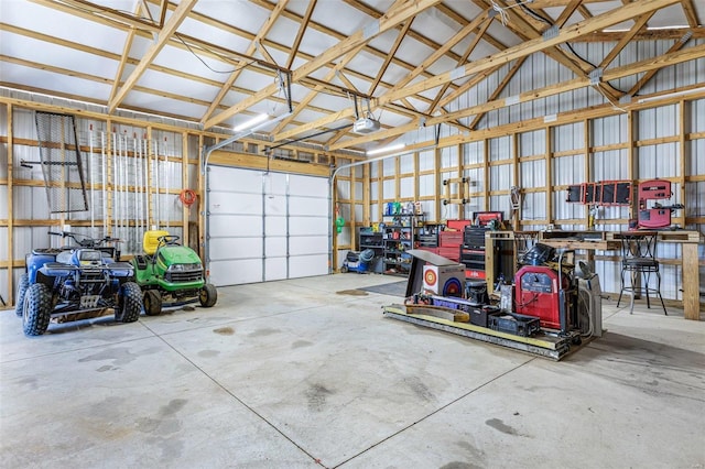 garage featuring a garage door opener and metal wall