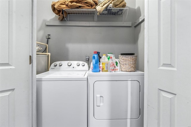 laundry room featuring independent washer and dryer and laundry area