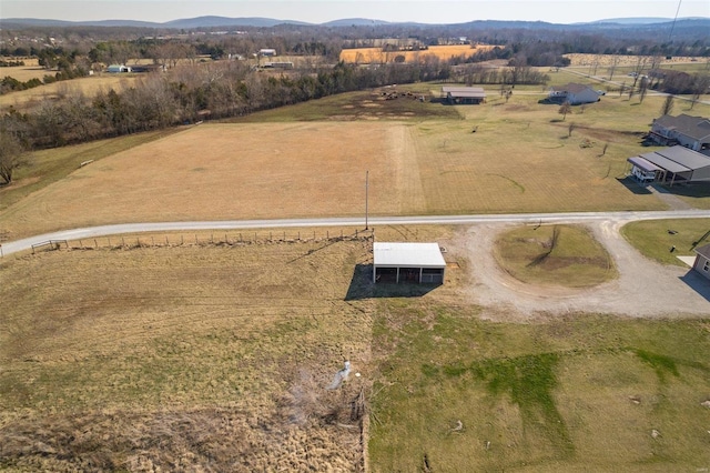 aerial view featuring a rural view and a mountain view