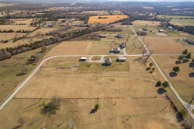 birds eye view of property featuring a rural view