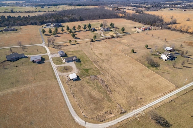 birds eye view of property with a rural view