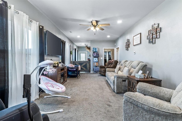 living area with recessed lighting, light colored carpet, and ceiling fan