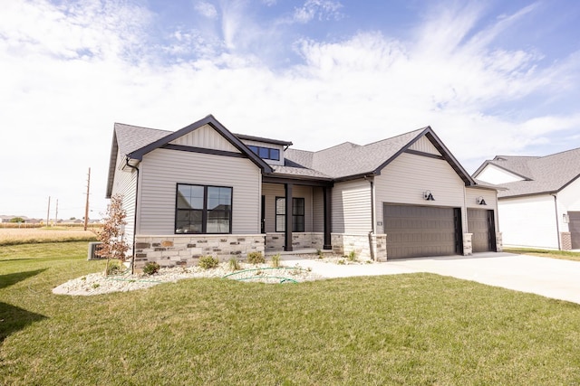 modern farmhouse style home with an attached garage, stone siding, driveway, and a front lawn