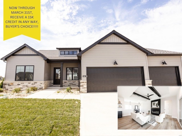 view of front of home featuring a front lawn, stone siding, driveway, and an attached garage