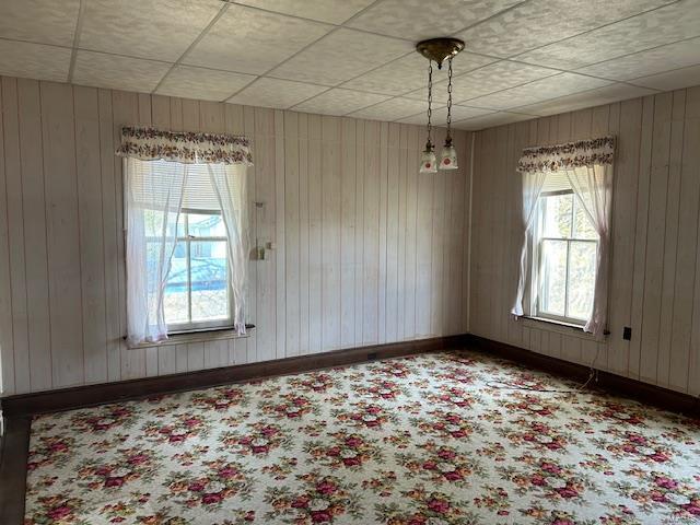 interior space with carpet floors and baseboards