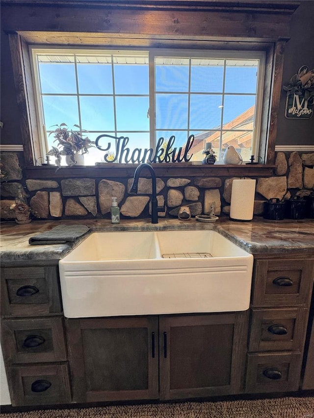 interior space featuring dark brown cabinets and a sink