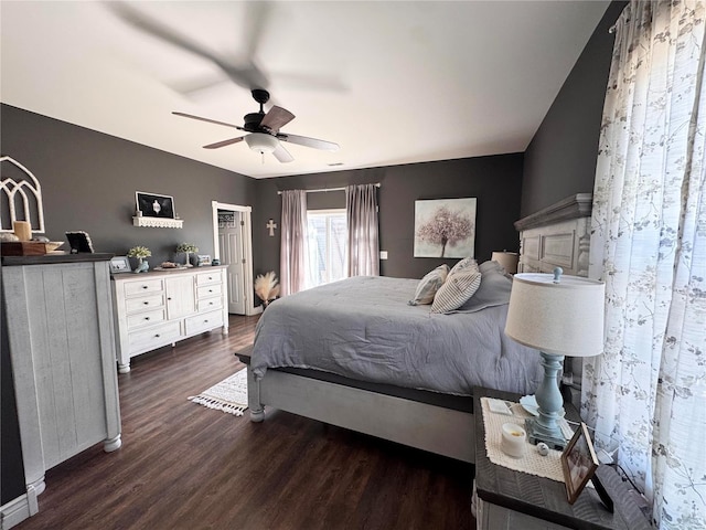 bedroom with a ceiling fan, access to outside, and dark wood finished floors