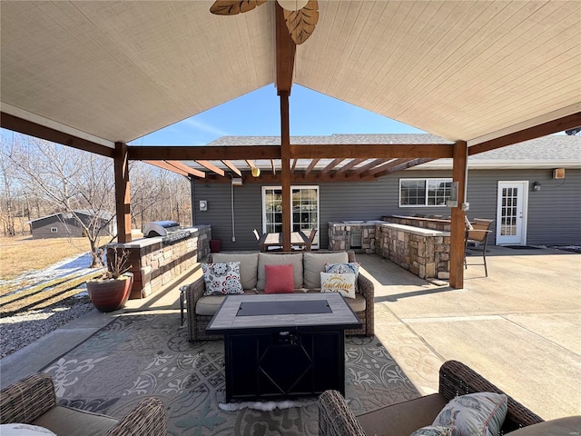 view of patio / terrace featuring an outdoor kitchen, outdoor lounge area, and a pergola