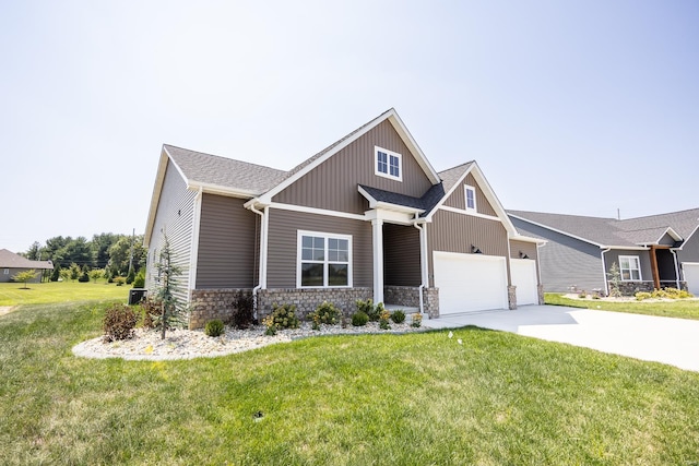 craftsman-style home featuring a garage, a shingled roof, stone siding, concrete driveway, and a front lawn