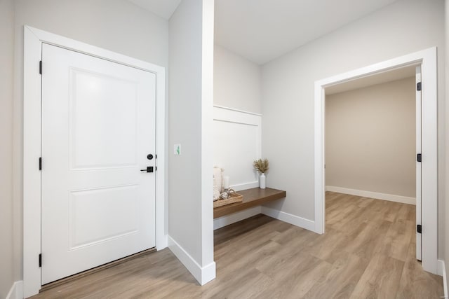 interior space with light wood-style flooring and baseboards