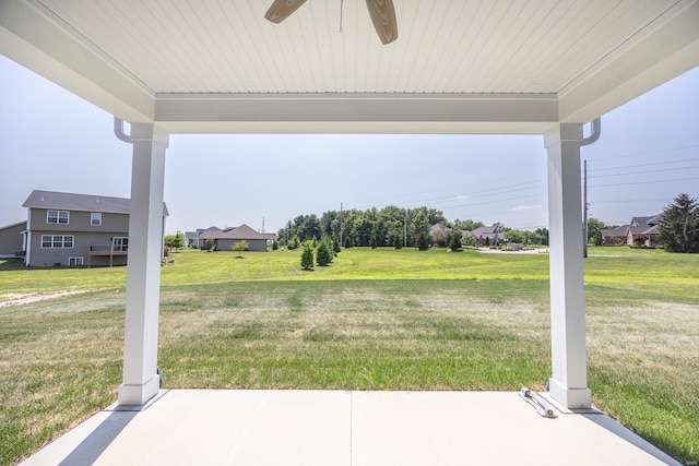 view of yard with ceiling fan