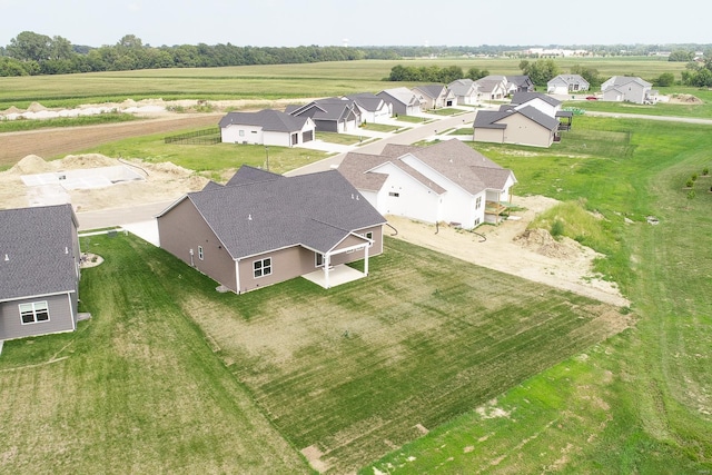 birds eye view of property with a residential view