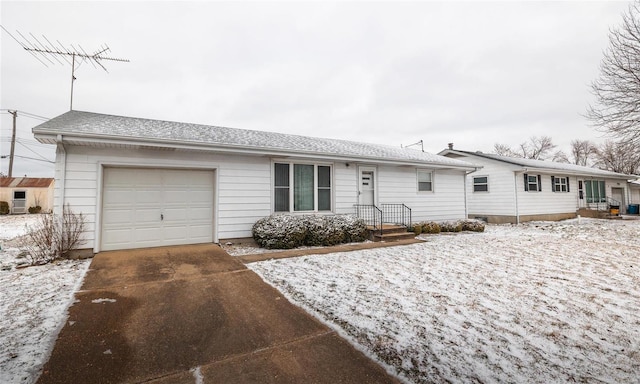 ranch-style house with driveway and an attached garage