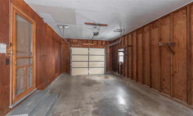 garage featuring wooden walls