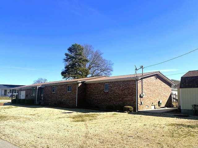 back of house with brick siding