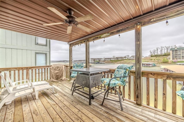 wooden deck featuring ceiling fan