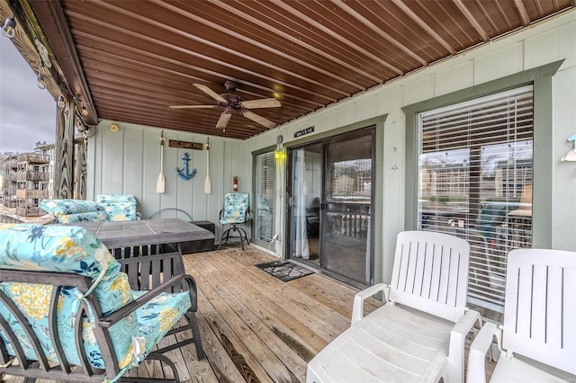 wooden terrace featuring ceiling fan