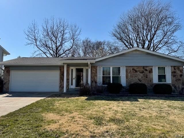 single story home featuring a front lawn, an attached garage, stone siding, and driveway