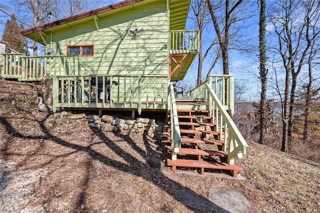 exterior space with stairway and a deck